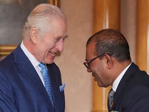 King Charles looks cheerful as cancer-battling monarch meets climate campaigner at Buckingham Palace