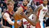 Miami Heat forward Jimmy Butler attempts a basket as Toronto Raptors guard Gradey Dick defends in the second quarter at Kaseya Center in Miami on Sunday, April 14, 2024.