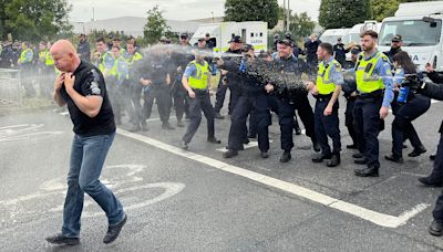 Protesters hurl 'missiles'at police at Dublin factory set for migrants