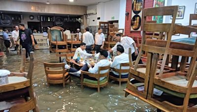 'But the party don’t stop’: Pic of people drinking in flooded Press Club in Delhi goes viral