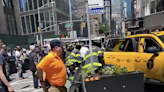 20 New Yorkers try to lift taxi after it jumped curb and pinned two women against a wall: ‘A remarkable scene’