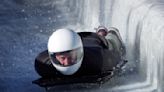 Prince Harry races head-first down a skeleton sled track and says 'everybody should do this'