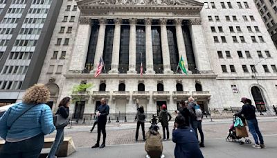 Stock market today: Wall Street points toward losses as markets digest earnings, dealmaking