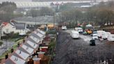 Families excavating a hillside to create space to live ordered by court to stop