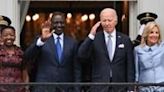 ..., Kenyan President William Ruto, US President Joe Biden and First Lady Jill Biden wave to the crowd during an official arrival ceremony on...