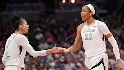 A'ja Wilson got her flowers from teammate Alysha Clark during a tearful Aces postgame presser