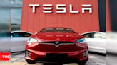 Tesla profit falls short again as Elon Musk demands investor patience - Times of India
