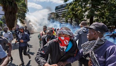 Police in Kenya open fire on protesters as crowd seek to storm parliament