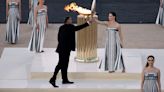 Paris organisers receive flame in Athens ahead of relay