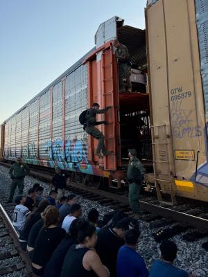 Migrants rescued from locked train car crossing US-Mexico border