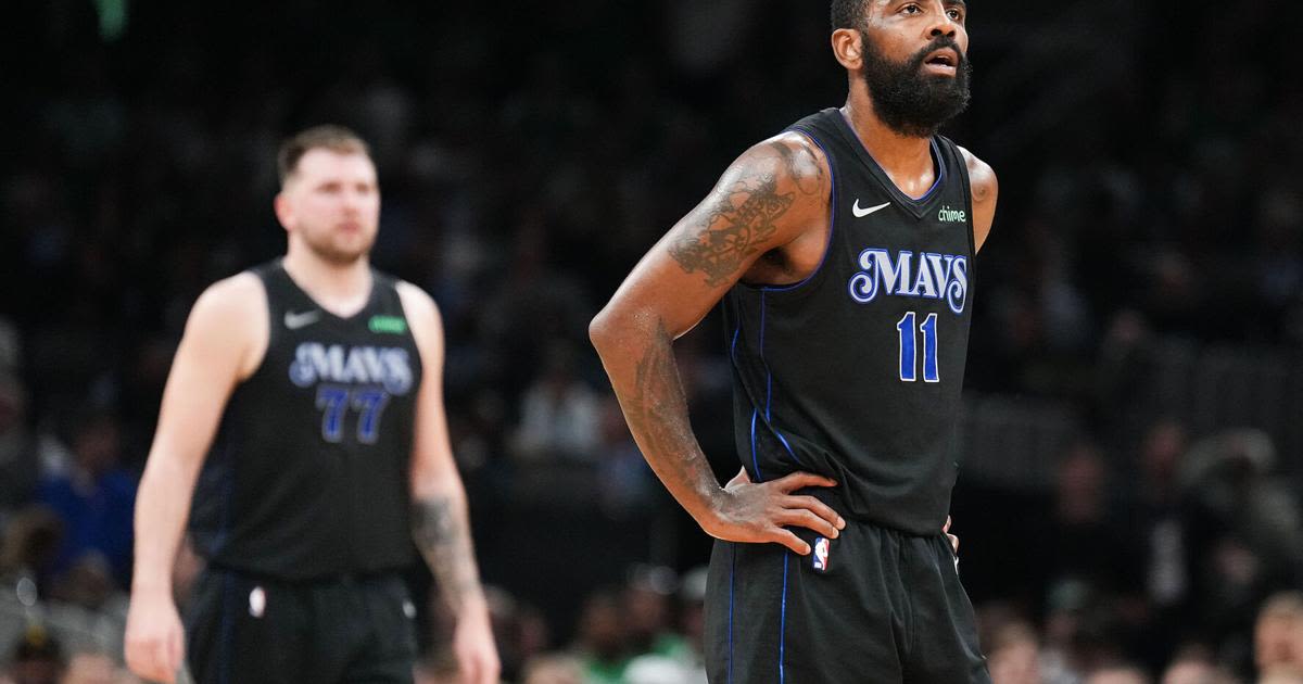 The Dallas Mavericks' Kyrie Irving and Luka Doncic...Boston Celtics basket during the first half in Game 1 of the NBA Finals at TD Garden on Thursday...