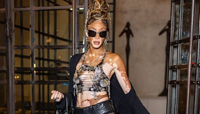 Winnie Harlow dares to bare in a VERY risqué crop top and mini shorts