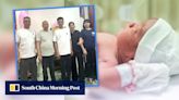 China couple told son died at birth, shocked to find him alive 33 years later