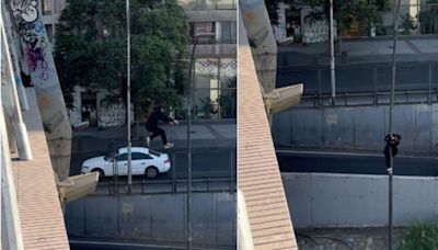 Joven saltó desde un puente a poste en Santiago Centro