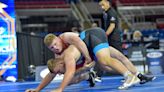 Western Reserve's Sam Cartella pushes through when Greater Akron wrestlers fall at Ironman