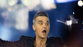 Robbie Williams fan fighting for life after horror fall during pop star’s concert
