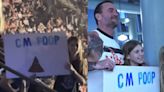 CM Punk Meets Fan With ‘CM Poop’ Sign After WWE RAW