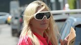 Kesha holds up cardboard sign that reads: 'I'm single' while out in LA