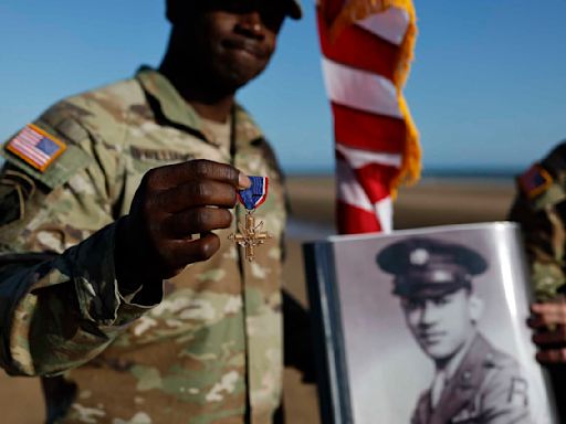 Black D-Day combat medic's long-denied medal tenderly laid on Omaha Beach where he bled, saved lives