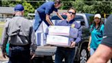 Florida Gov. DeSantis visits Tallahassee school to help distribute supplies after storm