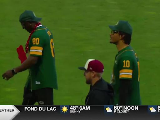 Donald Driver passes the Green Bay Charity Softball Game torch to Jordan Love after this year’s event