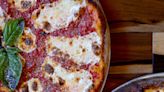Which Asheville restaurant ranks on Yelp's list of top pizzerias in all of US & Canada?