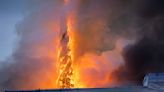 Fire rages through one of Copenhagen's oldest buildings, toppling iconic spire | ITV News