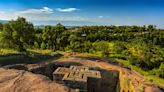 A 13th-century church that was carved from volcanic rock stands inside a deep pit in the earth — take a closer look