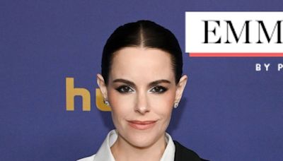 Emily Hampshire Puts a Twist on a Classic Black Tux at the Emmys (& It's Giving Major Moira Rose Vibes)