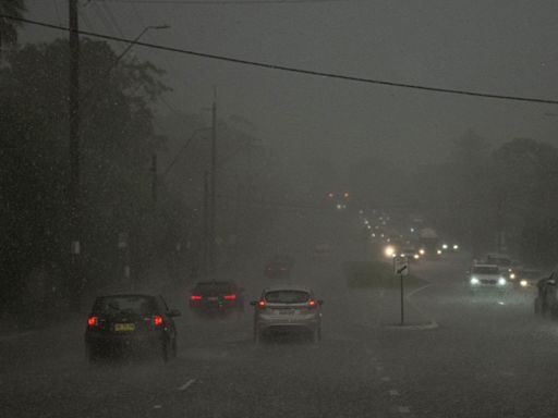 Sydney's northern beaches cut off by rain dump