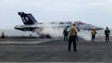 US, Japan and South Korea hold drills in disputed sea as Biden hosts leaders of Japan, Philippines