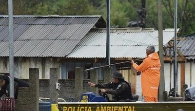 Flooding to worsen in Brazil's south, where many who remain are poor