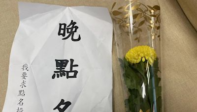 影/年輕馬尾女假冒記者混入立委研究室 被抓包拿板遮臉狂跳針喊：我沒有騙警察