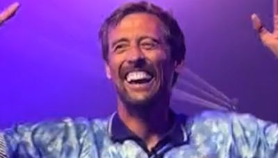 Peter Crouch jumps on stage and dances at Isle of Wight Festival