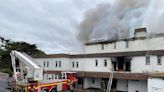 Firefighters work all night to bring large fire at derelict hotel under control