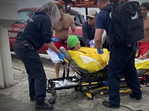 Shark attack victim punched it in the face before he was rescued, friend says