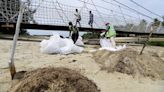 Singapore rushes to clean up oil slick after boat hits stationary fuel supply ship