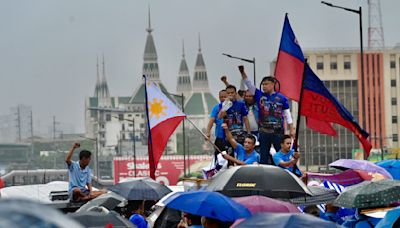 Undeterred by downpour, groups march to reject Marcos’ Bagong Pilipinas