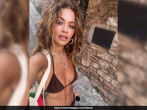 Rita Ora Is Sunkissed Under The Italian Sun In A Bohemian Chic Bralette Top And Printed Skirt