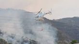 Incendios forestales en Tetela y Aquixtla son combatidos con helicópteros