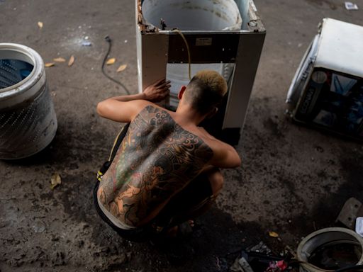 E-waste is overflowing landfills. At one sprawling Vietnam market, workers recycle some of it