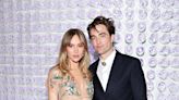 Suki Waterhouse flashes her tummy in low rise trousers