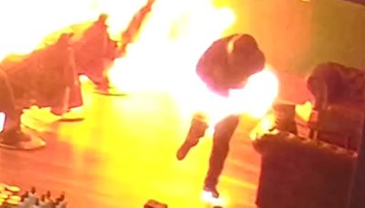 Wild moment arsonist catches fire after setting barbershop alight