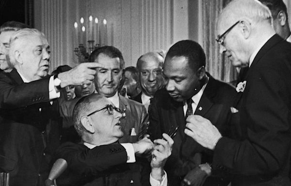 On this day in history, July 2, 1964, President Johnson signs 'sweeping' Civil Rights Act