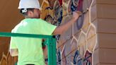 Why a world-renowned artist is painting a bee mural at Utah's Hogle Zoo