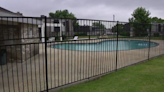 Woman attacked after telling group not to jump pool fence