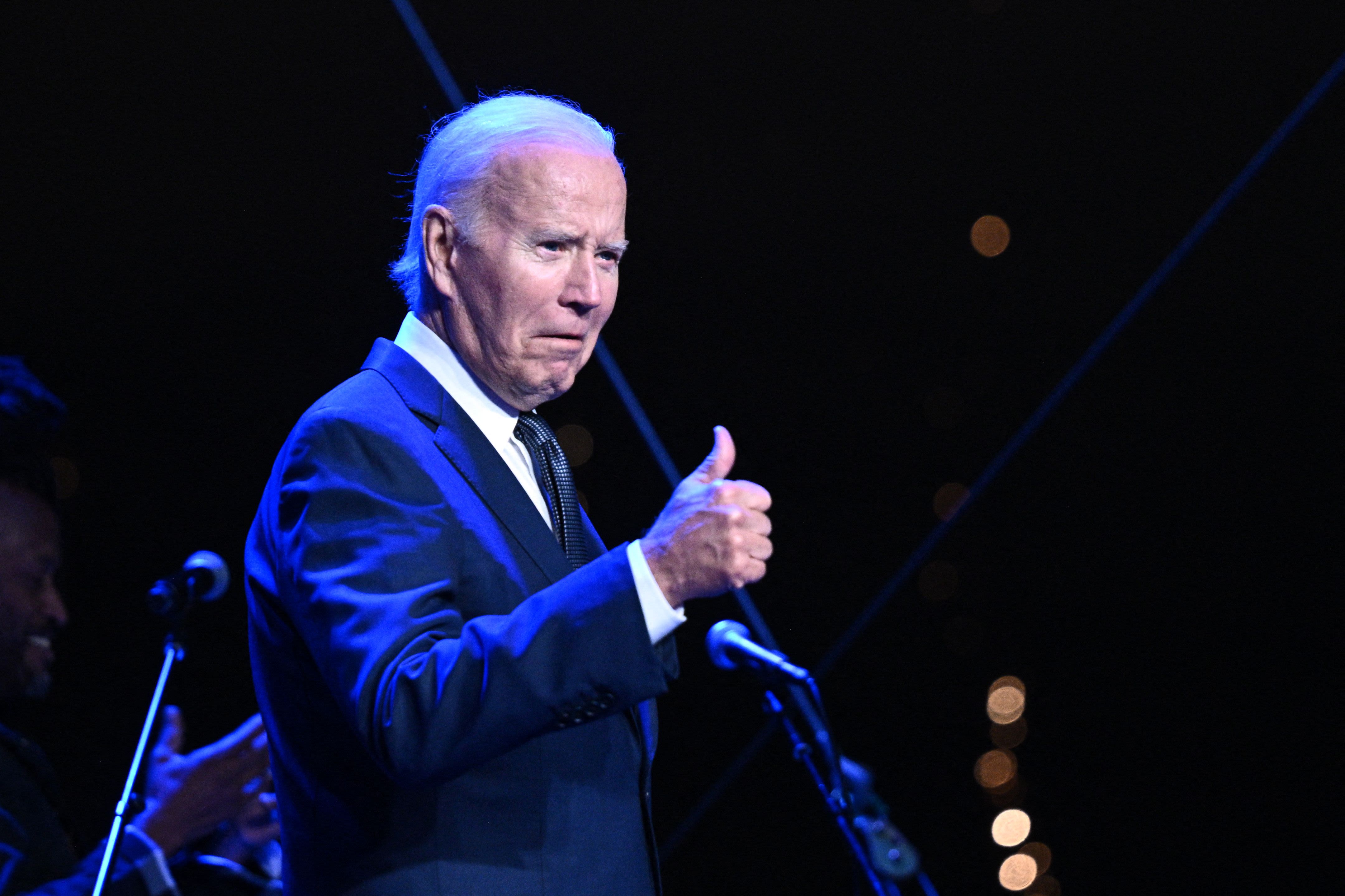 Biden long avoided touting stock market gains. Now he can't resist.