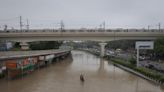 Floods force Indian capital to shut schools, offices, and plan water rationing