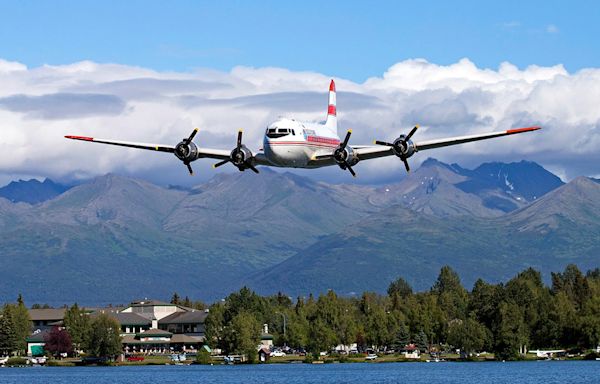 Vintage Douglas C-54 plane with 2 people on board crashes into Alaska riverbank