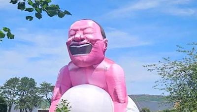 Giant inflatable squatting man which can be seen for miles appears in Welsh town